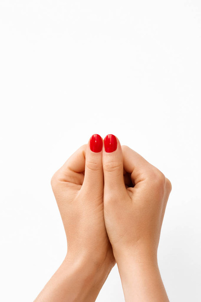 Photo of a Woman's Hands Showing Big Fingers with Red Manicure.  - Zdjęcie, obraz