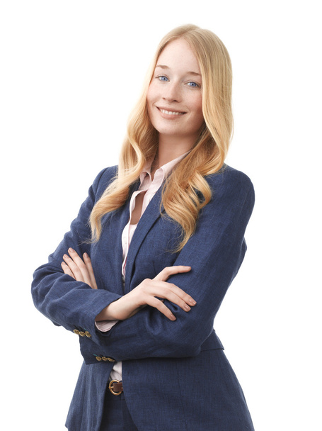 Smiling businesswoman standing against white background - Foto, Bild