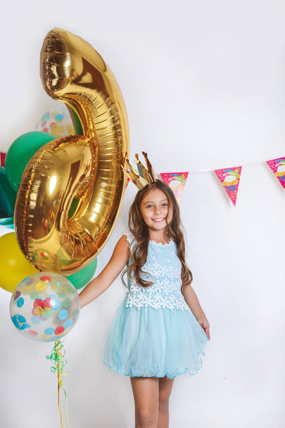 Beautiful little princess in blue dress. Birthday party for cute child. - Photo, Image