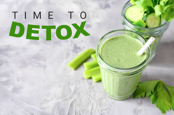 Glass of tasty green smoothie for detox diet on grey table - Fotografie, Obrázek