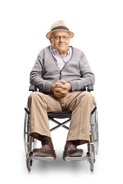 Full length portrait of a disabled senior man in a wheelchair looking at the camera isolated on white background - Photo, Image