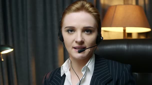 Call center operator answers the call and communicates with the client. Front view. - Footage, Video
