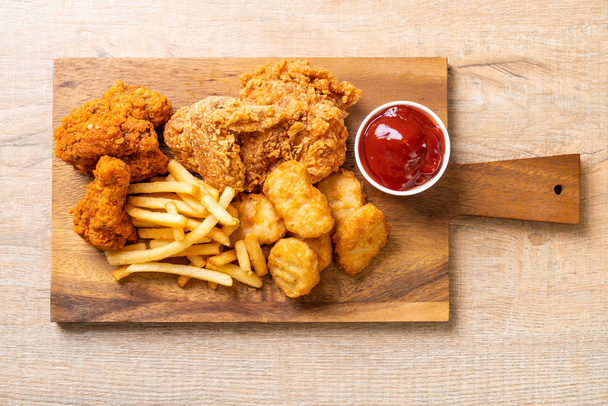 fried chicken with french fries and nuggets meal - Φωτογραφία, εικόνα