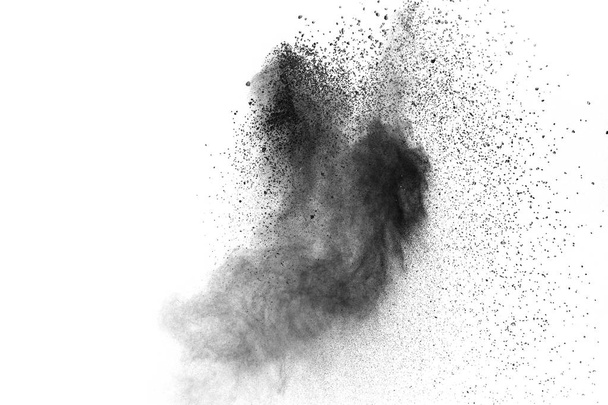 Explosão de pó preto no fundo branco.Partículas de poeira preta splash.Painted Holi pó festival
. - Foto, Imagem