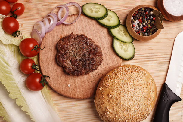 ingredients for homemade burger on wooden table - Фото, зображення