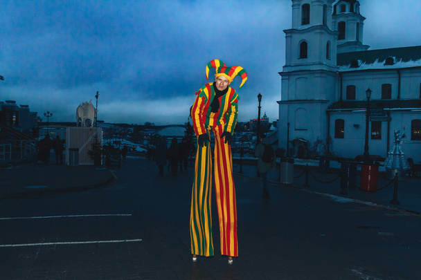 December 29, 2018 - Minsk, Belarus: New Year's celebrations on town square. man on stilts in clown costume stands on street - Photo, Image