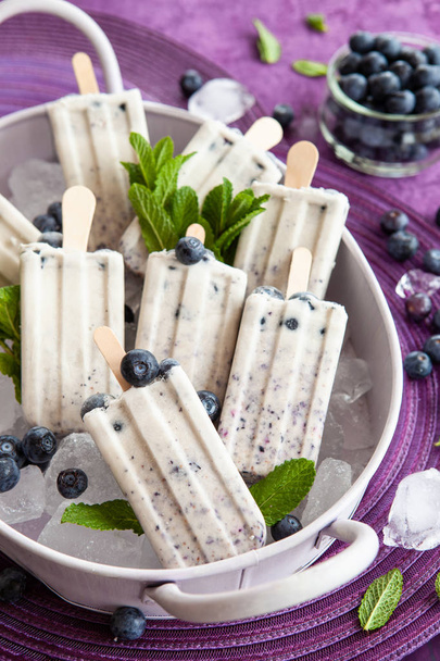 Ice cream popsicles with blueberries - Fotó, kép