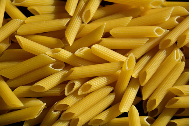 Closeup view of raw macaroni background, Italian food - Foto, Imagen