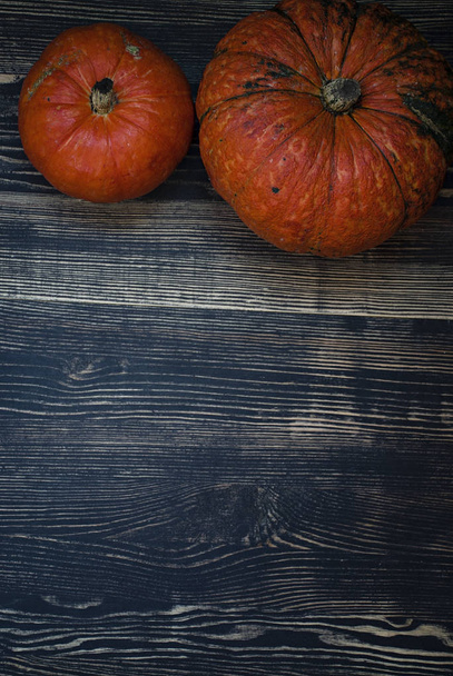 Pumpkin on a dark wooden background. - Foto, imagen