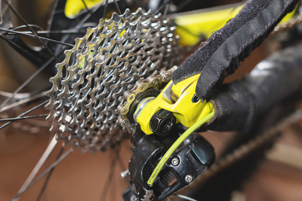 Close-up View of the bike in repair. Gear cassette close-up. Crafting service for mountain bikes. Repair guide for your site - Photo, Image