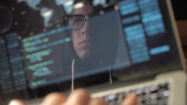 Double Exposure: Dangerous Hacker in the hood and glasses hacks the system - Footage, Video