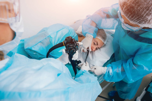 Endoscopy at the hospital. Doctor holding endoscope before gastroscopy. Medical examination - Fotografie, Obrázek