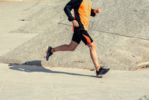 Runner man with sportswear training running in urban environment - Zdjęcie, obraz