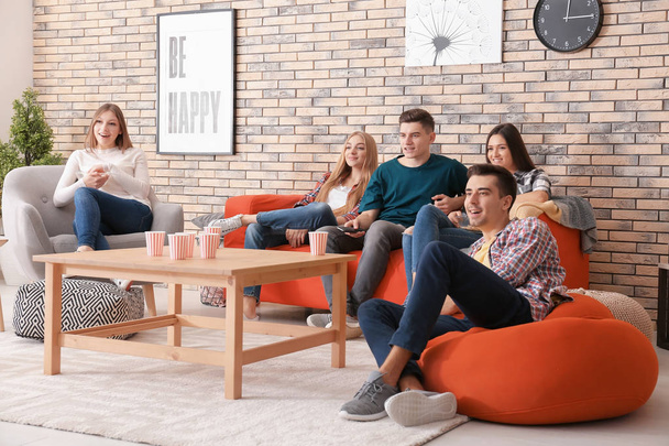 Young people watching movie in home cinema - Foto, Bild