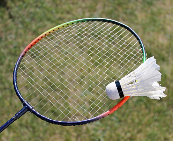 badminton shuttlecocks on racket - Fotoğraf, Görsel