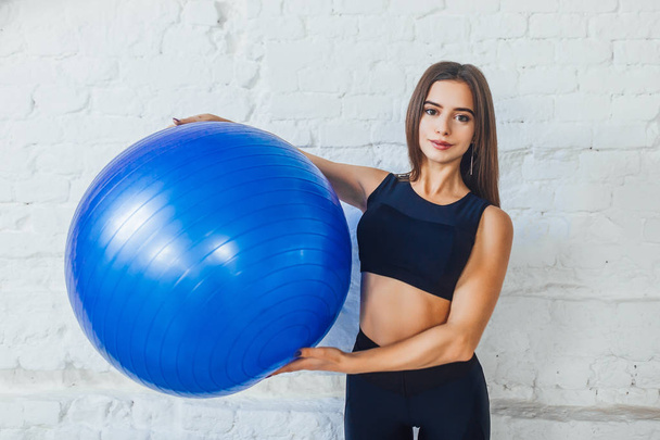 young woman training with fitness ball at gym  - Φωτογραφία, εικόνα