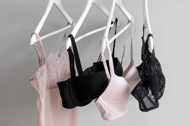 Vareity of bra hanging on a hanger. Textile, Underwear. Female bra in lingerie underwear store. Advertise, sale, fashion concept. - Fotografie, Obrázek