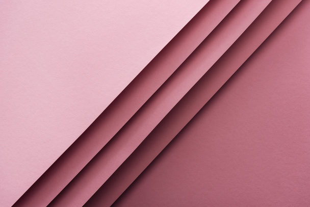 top view of blank and empty sheets of paper on pink background with copy space  - Фото, изображение