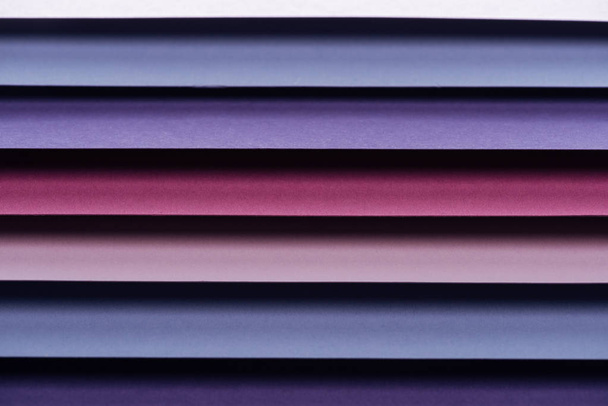 blue, pink, burgundy and purple sheets of paper with copy space  - Photo, Image