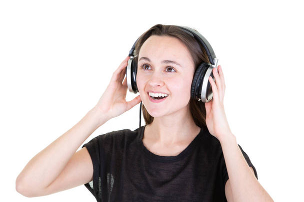 singing young woman with headphones listnening to music - Zdjęcie, obraz