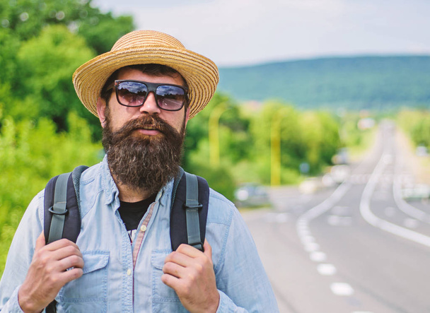 Tips of experienced traveler. Man bearded hipster backpacker at edge of highway. Take me with you. Traveler waiting for car take him anyway just to drop at better spot. Look for fellow travelers - Fotoğraf, Görsel
