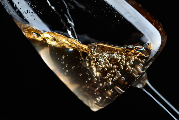 White wine being poured into glass. - Photo, Image