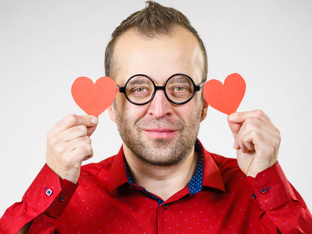 Man in love holding hearts - Valokuva, kuva
