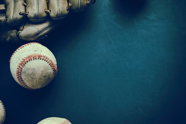 Old baseball with glove flat lay on grunge background with copy space for sports team season. - Photo, Image