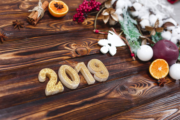 golden candles in form of numbers 2019 on wooden background - Фото, зображення