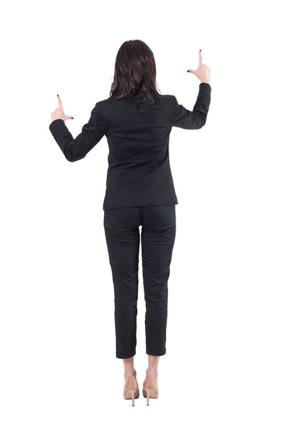 Back view of business woman in suit zooming and interacting with touch screen. Full body isolated on white background.  - Φωτογραφία, εικόνα
