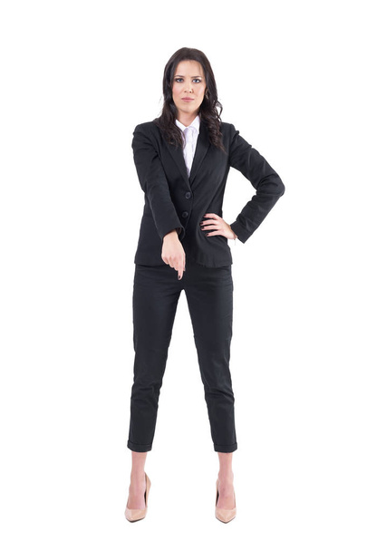 Angry bossy business woman patronizing looking at camera with finger pointing down. Full body isolated on white background.  - Fotó, kép