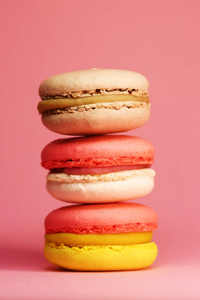 Bright food photography of macroons on pink background - Photo, image