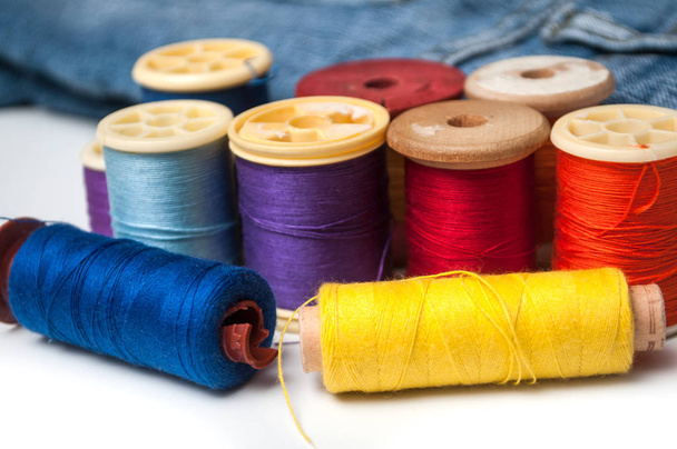 closeup of colorful sewing thread spool bobbins on white backgro - Fotoğraf, Görsel
