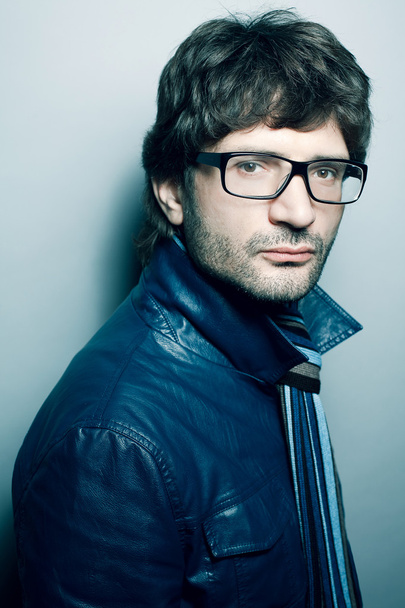 Portrait of a fashionable handsome man in blue jacket with strip - Fotoğraf, Görsel