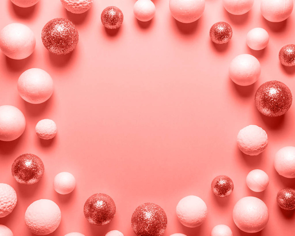 Christmas balls background toned in coral color. New Year minimal concept. - Fotoğraf, Görsel