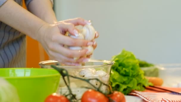 healthy eating cooking woman wash mushrooms bowl - Materiał filmowy, wideo