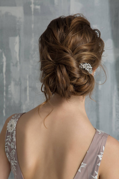 Hairstyle for the wedding. Back view. Modern wedding hairstyle - Фото, изображение
