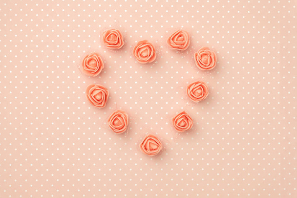Layout coral floral composition top view on living coral background. Flowers concept rose coral shape heart flat lay. 8 March Womens day. Mothers day pattern - Photo, Image