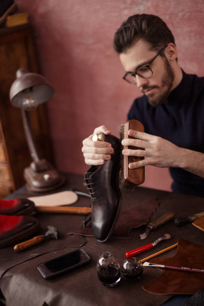 awesome shoeshine man working at home - 写真・画像