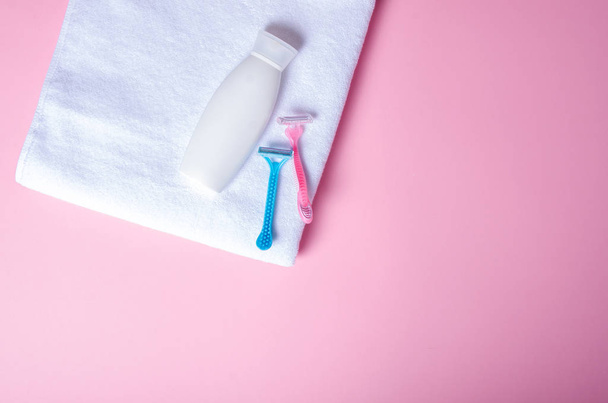 White towel, bottle cream, lotion, razor, soft beauty - Photo, image