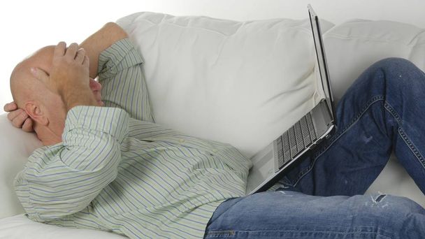 Relaxed Businessman Staying on the Couch in Living and Work Using Laptop. - Fotoğraf, Görsel