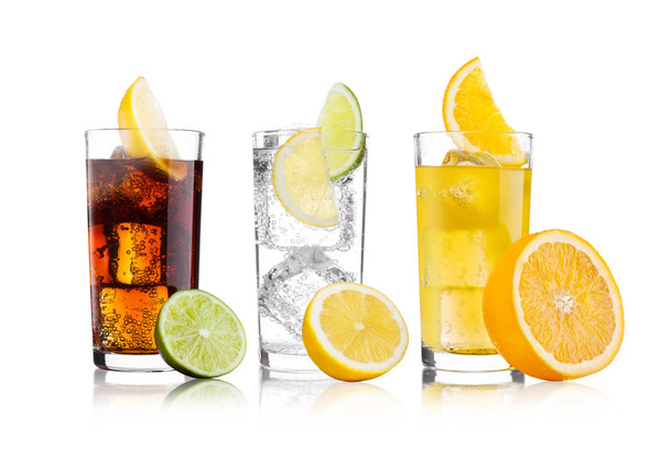 Glasses of cola and orange soda drink and lemonade - Valokuva, kuva
