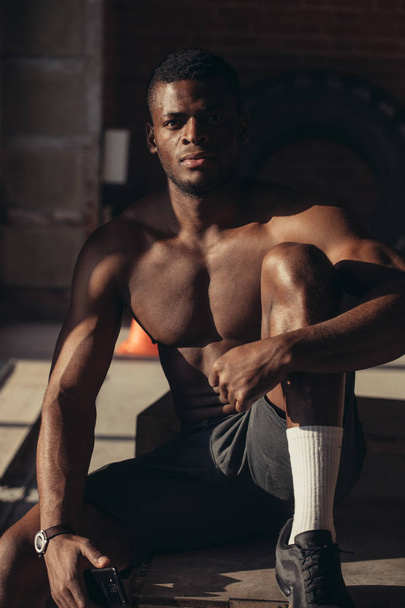 Handsome African bodybuilder man with naked muscular torso. Sport Concept. - Foto, afbeelding