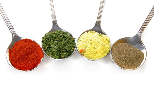 Spices on spoons - Фото, зображення
