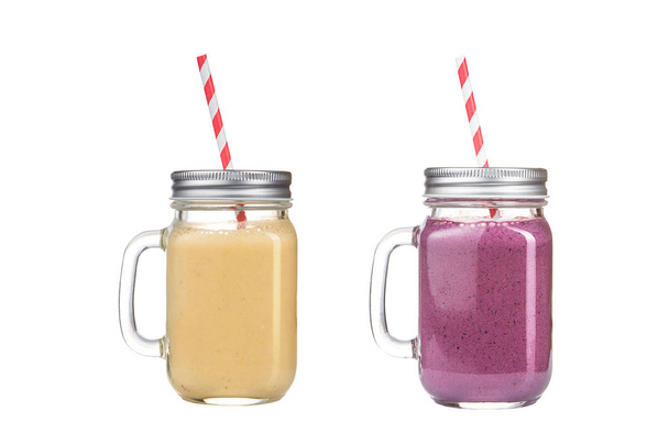 Refreshing delicious smoothies in glass jars on a white background. - 写真・画像