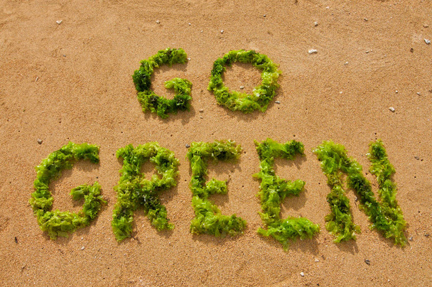 "Go Green" text made with green seaweed - Photo, Image