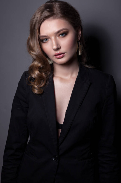 Portrait of a beautiful woman in a black jacket.  - Фото, зображення