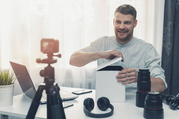 social media technology influencer recording unboxing video at h - Photo, image