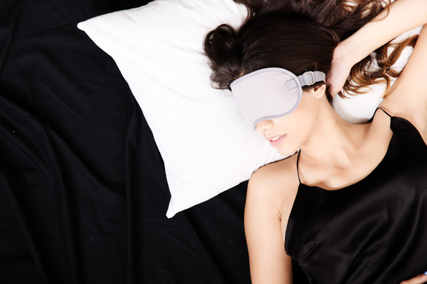 Young woman sleeping with Eyeshades - Valokuva, kuva
