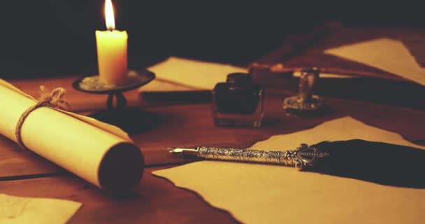 old quill pen on parchment paper in candlelight - Footage, Video